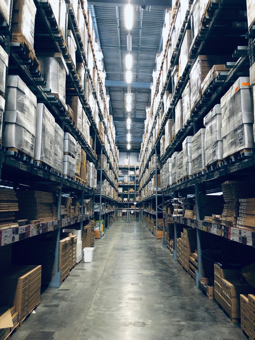 Warehouse aisle stacked with inventory