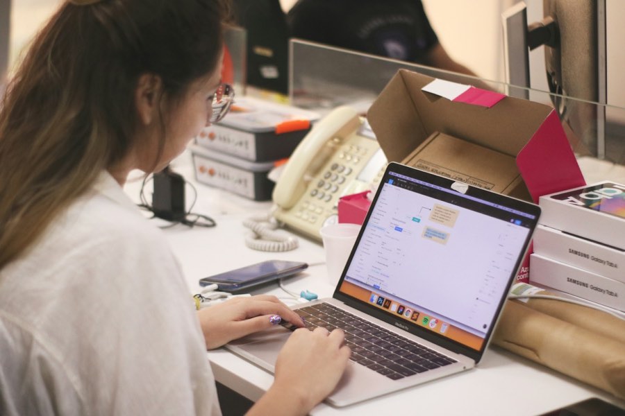 Reviewing store orders and fulfillment on a laptop